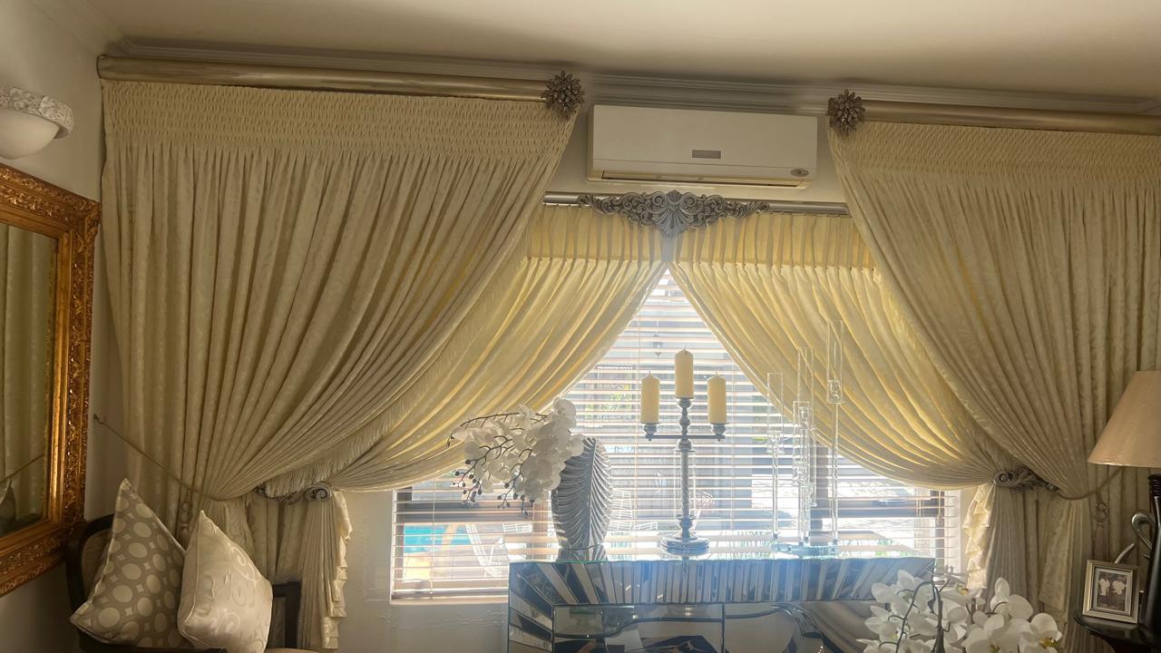 Statement wave curtains in gold jacquard, poolside living room